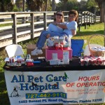 Lynda, technician extraordinaire of All Pet Care Hospital in Clearwater, Florida, carries Pam, customer and patient care expert to heights of giddy silliness at the Mutt Strutt 2011